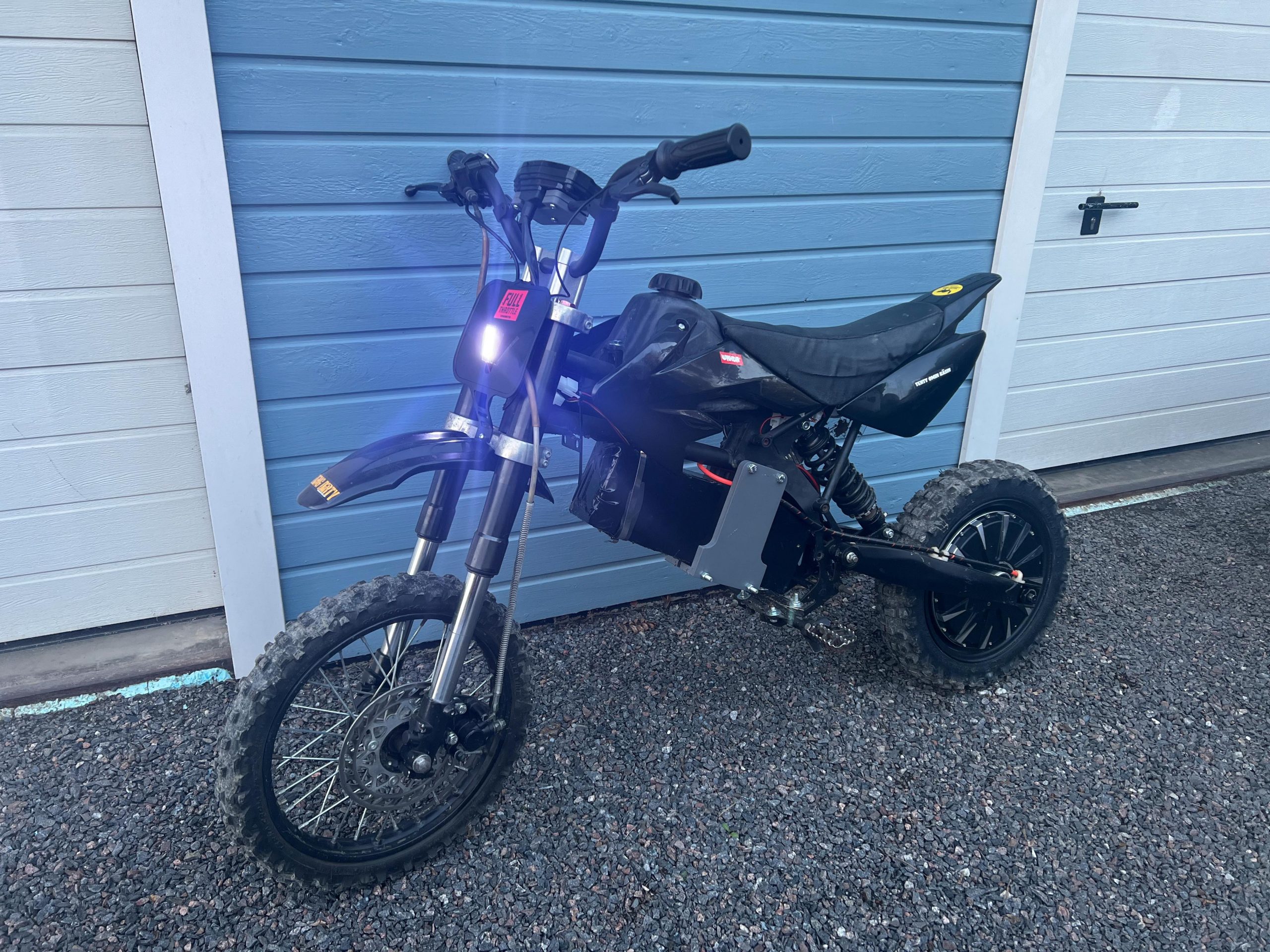 Electric pit bike with headlights on