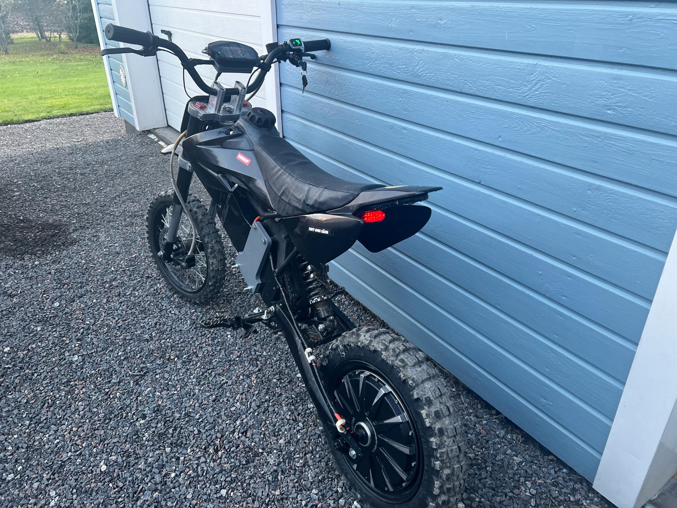 Electric pit bike with tail lights on